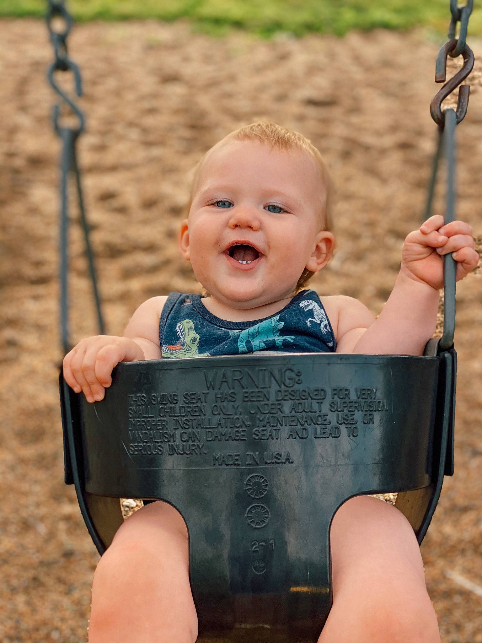 Kooper is registered to the contest to win money with this photo: baby, chin, eye, face, facial_expression, finger, fun, grass, hairstyle, hand, happy, head, human, leisure, person, photograph, public_space, skin, smile, standing