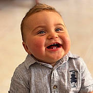 Marceau participe au concours pour gagner de l'argent avec cette photo : baby, child, smiling, happy, face, blue_eyes, teeth, shirt, striped_shirt, indoor, portrait, cute, infant, toddler, short_sleeve, buttoned_shirt, blurry_background, closeup, cheerful, small_child