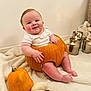 autumn, baby, blanket, candles, child, cozy, cute, face, festive, green_pumpkin, hands, happy, holiday, indoors, orange, pumpkin, sitting, smile, soft_texture, white_pumpkin