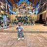 Alexander joined the competition — help win amazing prizes! altar, bow_tie, bright, child, church, colorful, decor, flowers, happy, indoor, mural, person, potted_plants, religious_art, smiling, suspended_ceiling, suspenders, tile_floor, toddler, walking