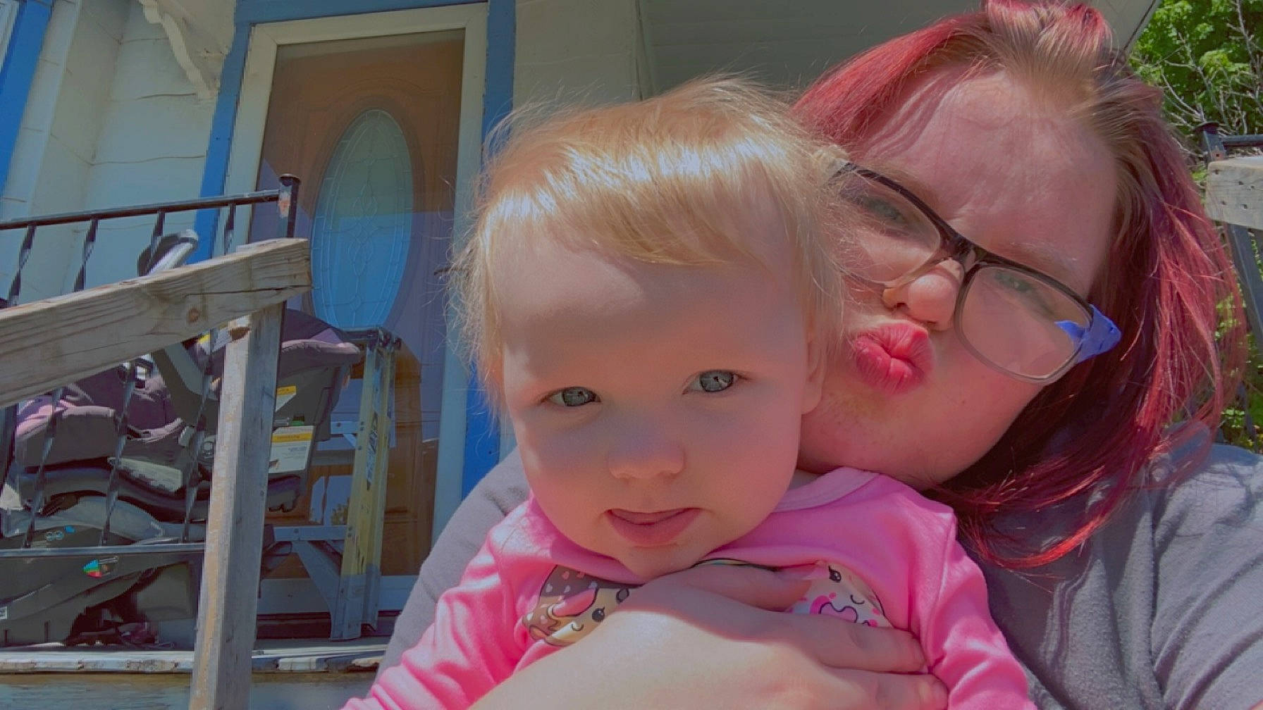 Scarlett is registered to the contest to win money with this photo: baby, baby_toddler_clothing, blond, cheek, chin, ear, eye, eyelash, fun, gesture, glasses, happy, iris, leisure, lip, nose, person, pink, skin, toddler