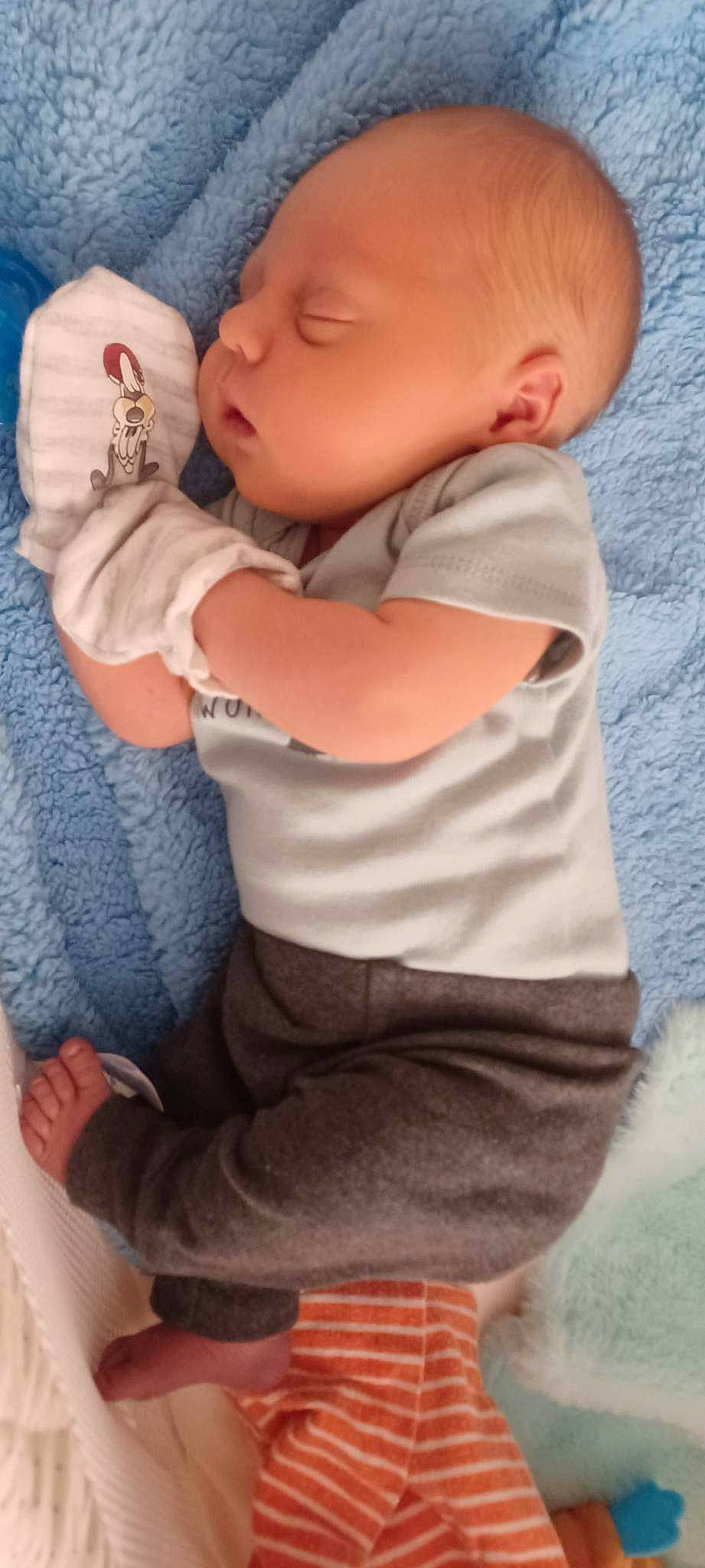 Kyson is registered to the contest to win money with this photo: arm, baby, baby_toddler_clothing, blue, cheek, child, doll, finger, gesture, hand, happy, joint, nail, nose, person, skin, sleeve, t_shirt, thumb, toddler