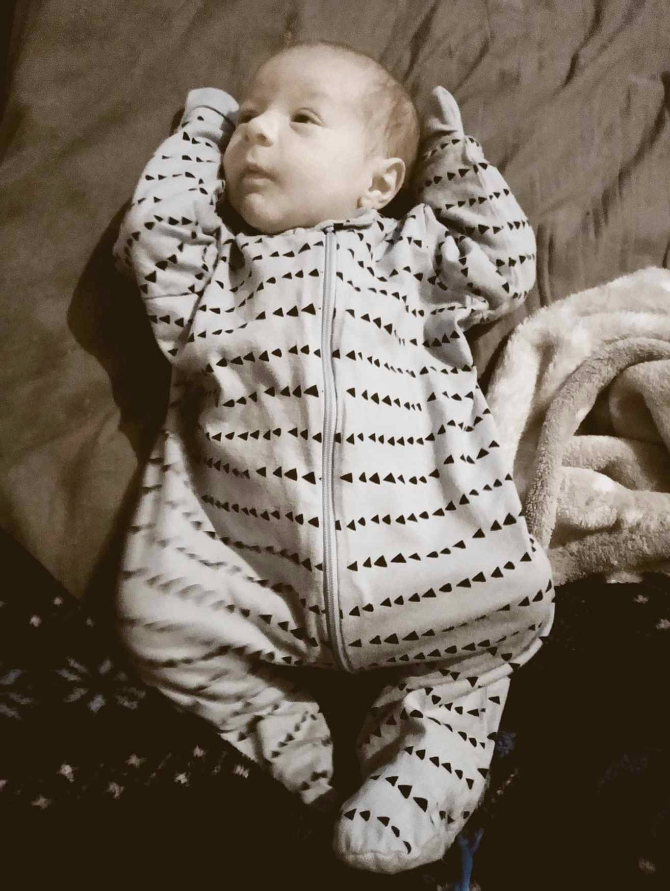 Zander is registered to the contest to win money with this photo: art, baby, baby_products, baby_toddler_clothing, child, comfort, eye, fur, grass, happy, head, human_body, linens, monochrome, monochrome_photography, pattern, person, sitting, sleeve, toddler