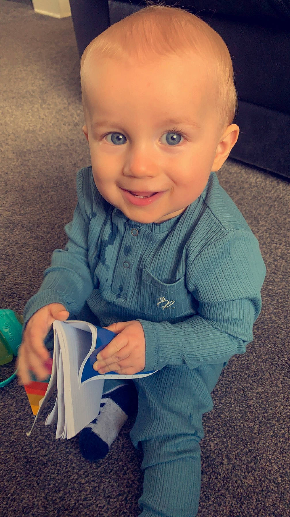 Arlo is registered to the contest to win money with this photo: baby, baby_toddler_clothing, cheek, child, cool, electric_blue, finger, flooring, fun, gesture, happy, human_body, iris, joy, mouth, nose, person, skin, sleeve, smile