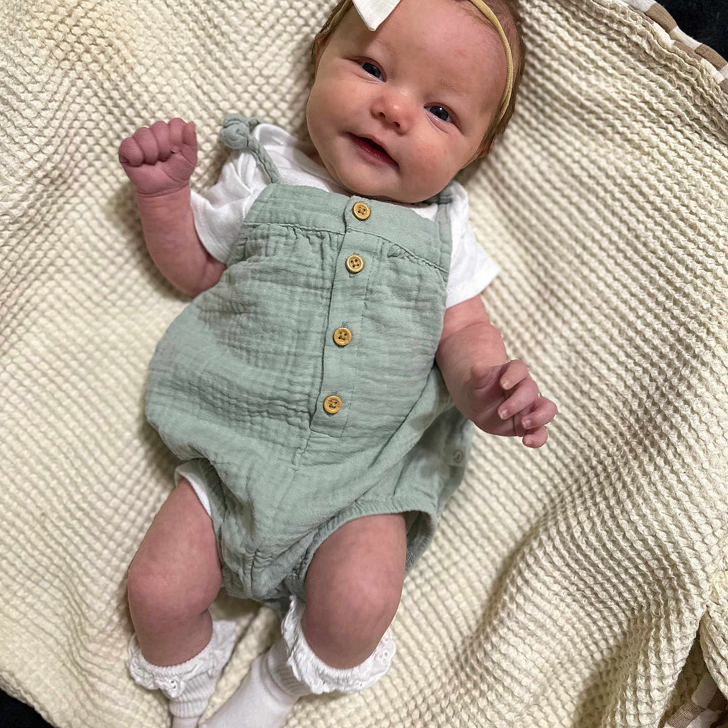 Indy is registered to the contest to win money with this photo: baby, bed, blanket, clothing, couch, dress, face, furniture, hat, head, homedecor, jeans, linen, newborn, pants, person, photography, portrait, quilt, shorts