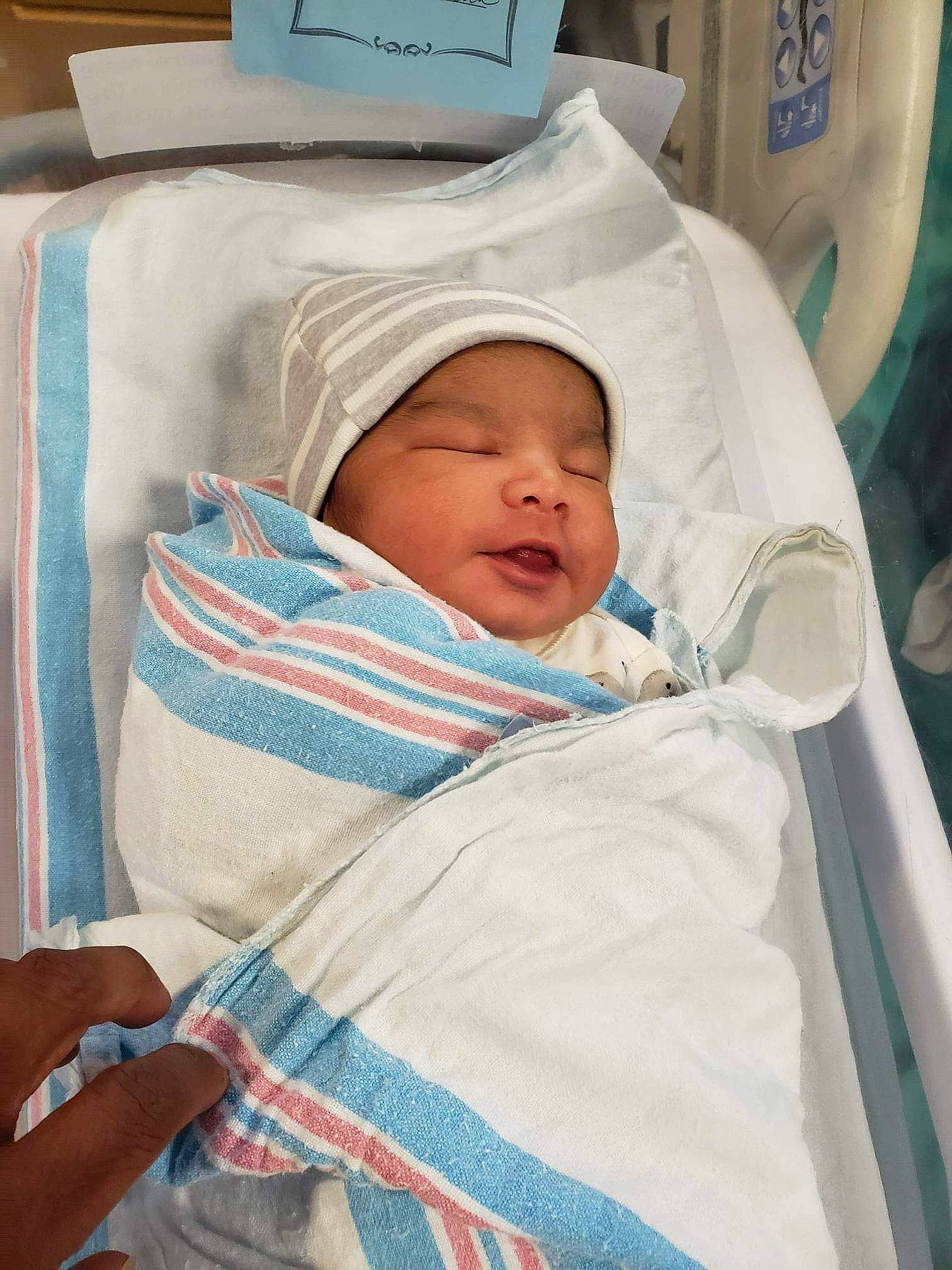 Armani is registered to the contest to win money with this photo: baby, baby_products, baby_safety, baby_sleeping, bedding, bedtime, child, childbirth, comfort, event, eye, hat, headwear, hospital, linens, medical, nap, person, room, service