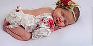 Wren joined the competition — help win amazing prizes! newborn, baby, sleeping, flower_headband, floral_outfit, lace, infant, cute, peaceful, portrait, soft_texture, white_background, child, resting, tiny_hands, closed_eyes, delicate, adorable, cozy, studio_photo