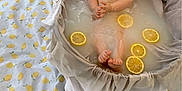 Eden participe au concours pour gagner de l'argent avec cette photo : baby, bathtub, blanket, child, cute, decor, expression, flower_vase, foot, hands, indoors, infant, lemon_slices, lemons, milk_bath, relaxed, skin, soft_light, water, white_tulips