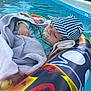 Eden a rejoint le concours — aidez-le/la à gagner de superbes lots ! baby, blanket, blue, cap, child, floating, inflatable_ring, outdoor, pacifier, peaceful, pool, relaxation, rubber_ducky, sleeping, soft, striped, summer, toddler, toy, water