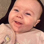 Sofia joined the competition — help win amazing prizes! baby, smiling, face, infant, pink_clothing, embroidered, daisy, earring, cute, close_up, happy, child, person, soft_texture, button, apparel, portrait, skin, head, eyes