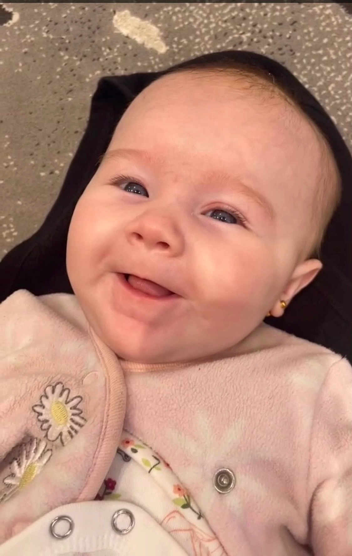 Sofia joined the competition — help win amazing prizes! baby, smiling, face, infant, pink_clothing, embroidered, daisy, earring, cute, close_up, happy, child, person, soft_texture, button, apparel, portrait, skin, head, eyes