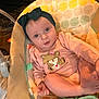 Abby joined the competition — help win amazing prizes! baby, child, headband, pink_clothing, bear_graphic, infant_seat, polka_dot_pattern, indoors, person, cute, face, young_child, sitting, foot, hand, looking_up, cozy, soft_lighting, baby_girl, expression