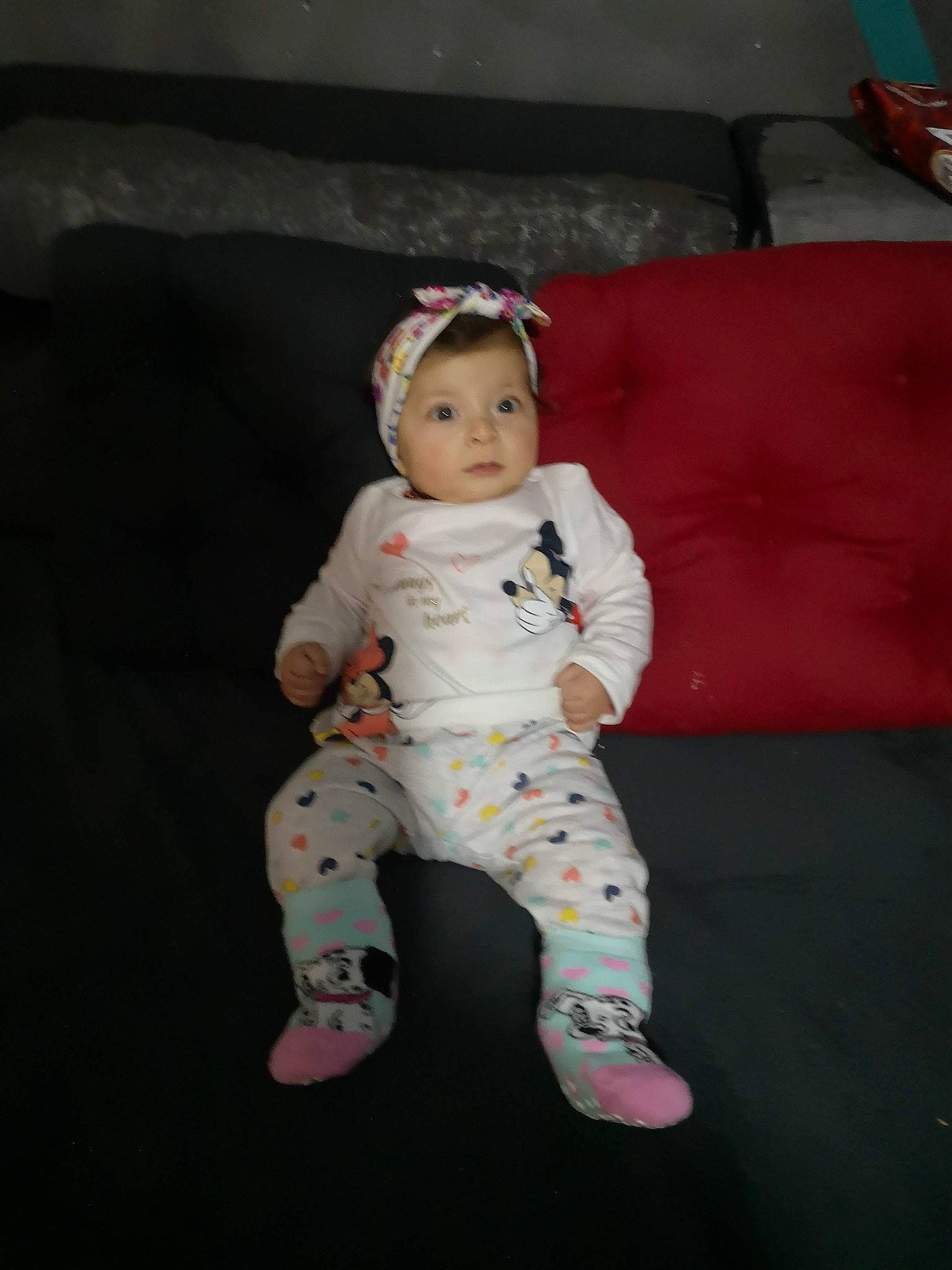 Lilia participe au concours pour gagner de l'argent avec cette photo : baby, baby_products, baby_toddler_clothing, barefoot, carmine, cheek, child, costume, couch, flooring, foot, fun, fur, linens, pattern, person, play, sitting, sleeve, sock