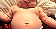 Calissia joined the competition — help win amazing prizes! baby, infant, diaper, skin, pillow, curly_hair, chubby, arm, leg, face, expressionless, indoor, closeup, cute, child, human, newborn, soft_lighting, relaxing, comfortable