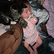 Brileyann is registered to the contest to win money with this photo: baby, cat, blanket, pacifier, tattoo, sleepwear, infant, animal, pet, bed, comfort, snuggle, fur, rest, cute, sleep, home, cozy, person, nighttime