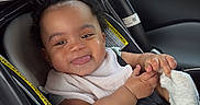 Wynter is registered to the contest to win money with this photo: baby, car_seat, child, smiling, tongue_out, plush_toy, unicorn, toy, car_interior, seatbelt, window, greenery, hand, sock, clothing, person, cute, infant, happy, travel