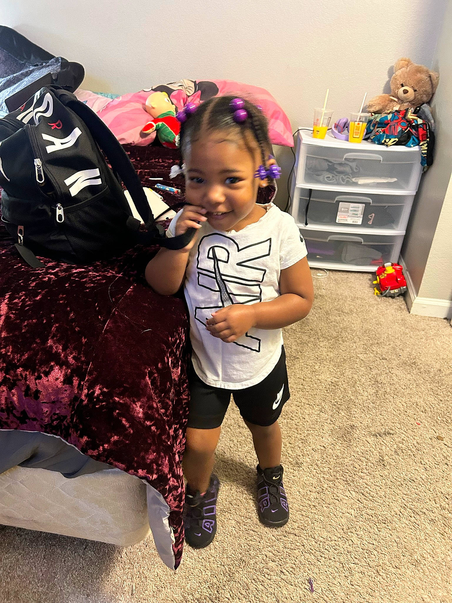 Mila-marie is registered to the contest to win money with this photo: backpack, bag, child, event, fashion_accessory, flooring, fun, happy, human_leg, joy, luggage_and_bags, magenta, person, personal_protective_equipment, shoe, shorts, sneakers, sock, t_shirt, television