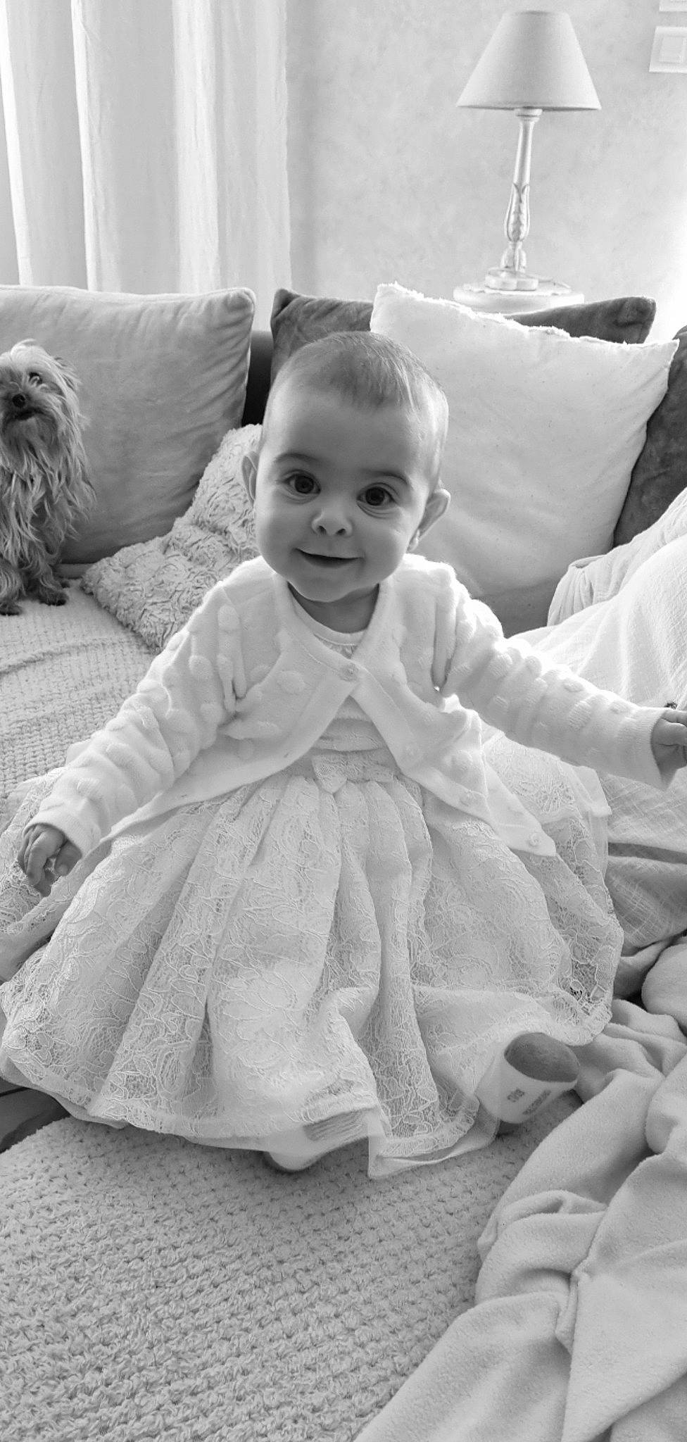 Julia participe au concours pour gagner de l'argent avec cette photo : baby_toddler_clothing, black, black_and_white, comfort, dress, facial_expression, fun, grey, hairstyle, happy, human, iris, joy, person, photograph, product, skin, sleeve, smile, standing