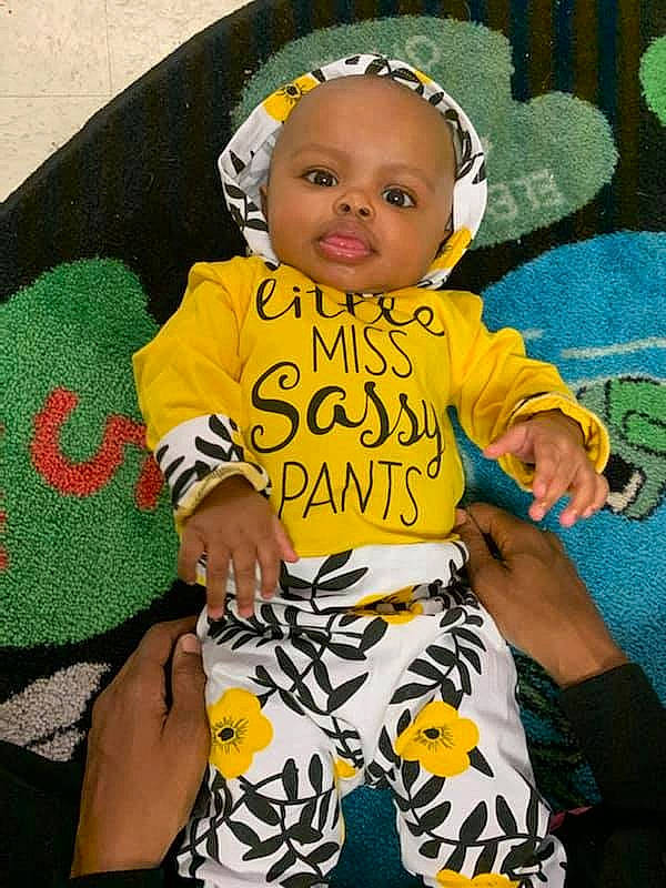 Lillianna joined the competition — help win amazing prizes! baby, baby_products, baby_toddler_clothing, child, pattern, person, product, sleeve, textile, toddler, yellow