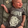 Albie is registered to the contest to win money with this photo: baby, infant, smiling, clothing, nirvana, onesie, pacifier, lying_down, happy, cute, child, skin, head, arm, leg, expression, indoors, fabric, padded_surface, casual
