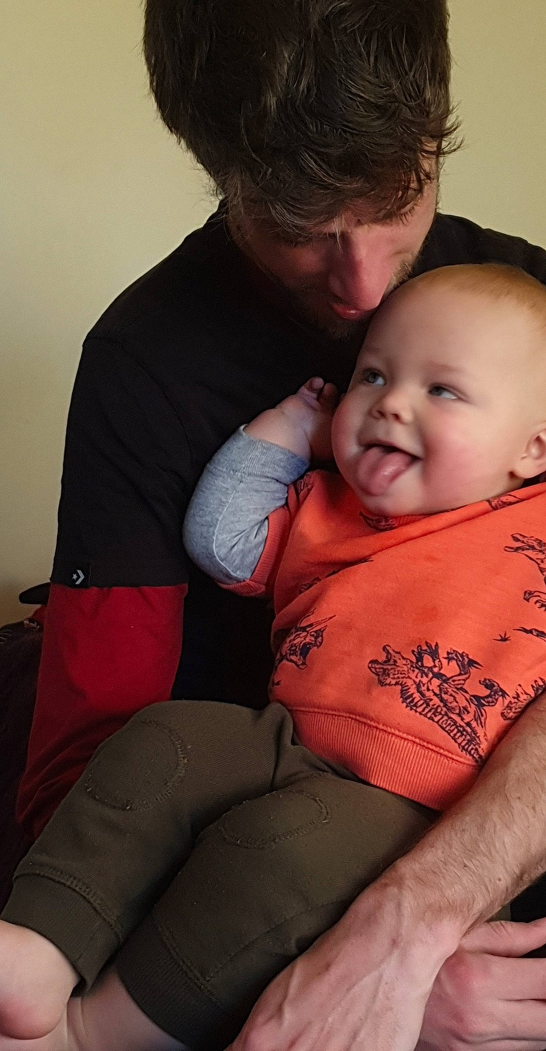 Frederick is registered to the contest to win money with this photo: arm, baby, cheek, child, father, hug, love, mother, person, smile, toddler