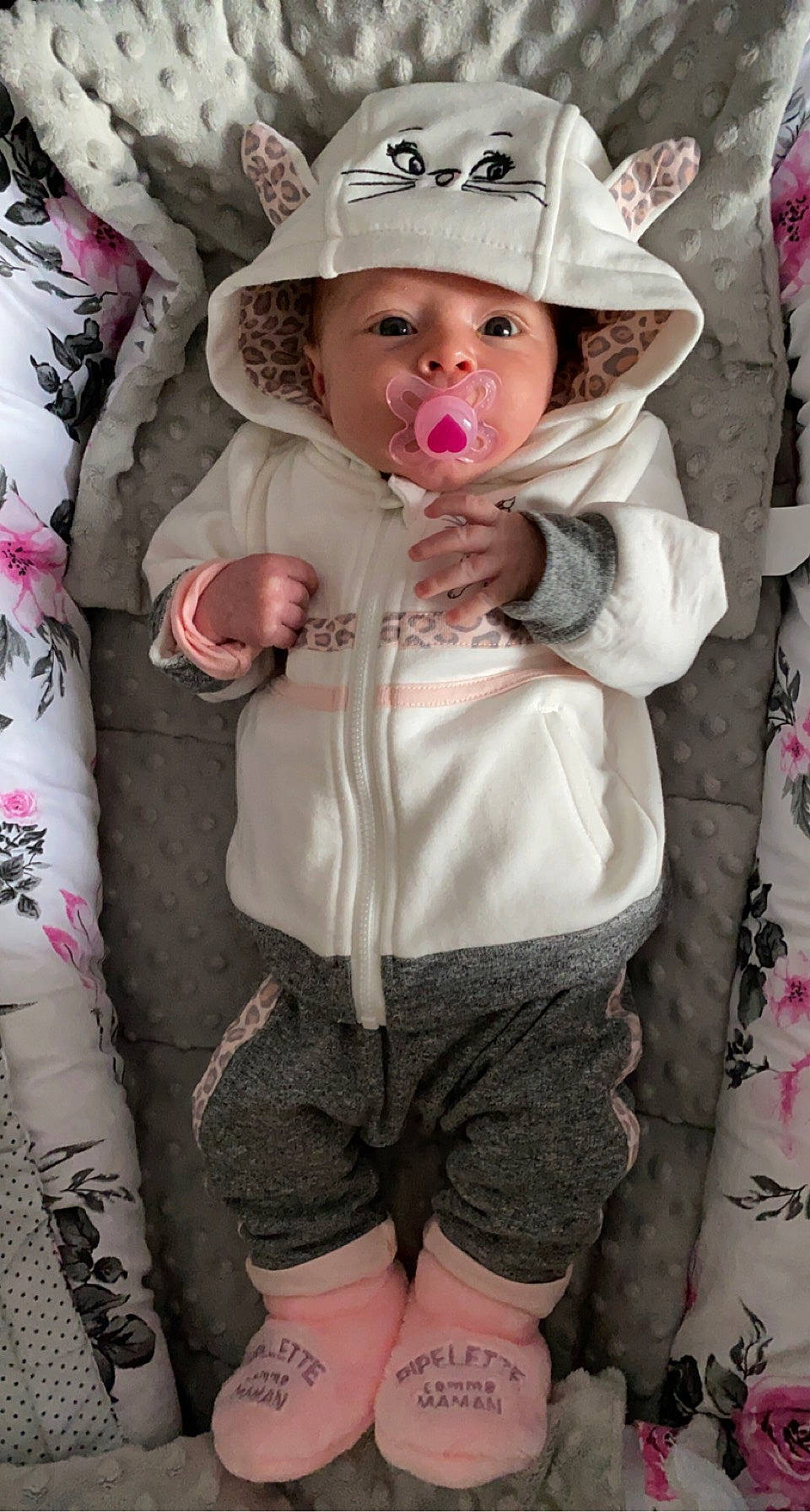 Carmen participe au concours pour gagner de l'argent avec cette photo : baby, baby_toddler_clothing, cap, clothing, face, fashion, happy, hat, head, headwear, human, lip, outerwear, person, pink, skin, sleeve, smile, sun_hat, textile