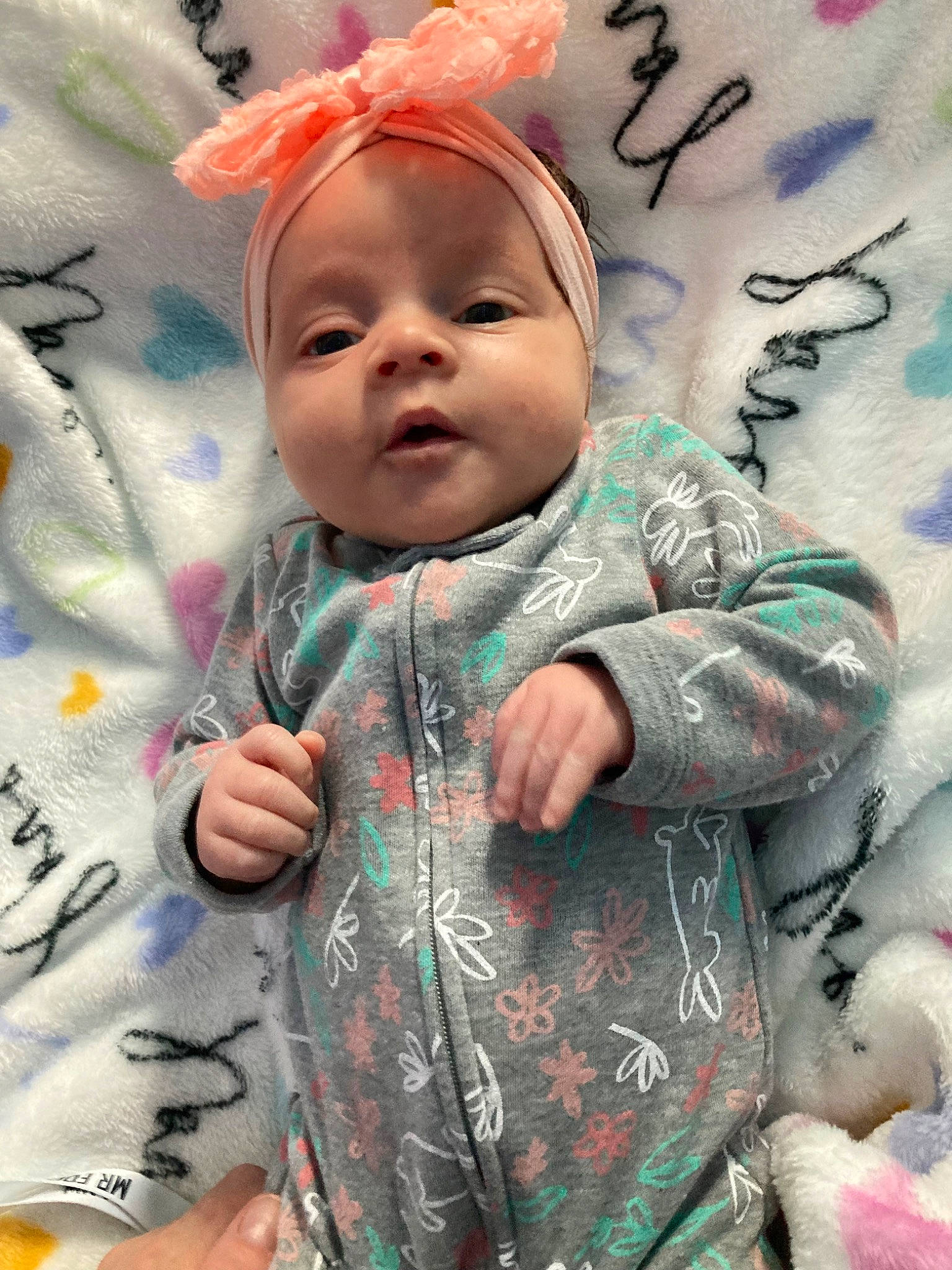 Remy is registered to the contest to win money with this photo: baby, baby_products, baby_toddler_clothing, cap, cheek, child, cool, event, finger, gesture, happy, iris, linens, pattern, people_in_nature, person, pink, skin, sleeve, t_shirt