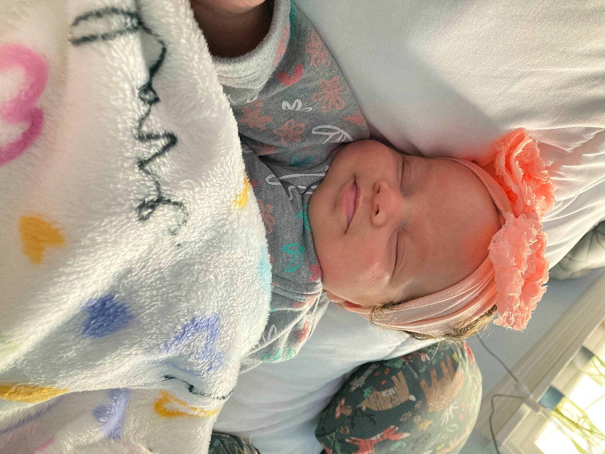 Remy is registered to the contest to win money with this photo: arm, baby, baby_products, baby_toddler_clothing, bedtime, cheek, child, comfort, fun, hair, happy, headwear, linens, mouth, nose, pattern, person, product, skin, sleeve