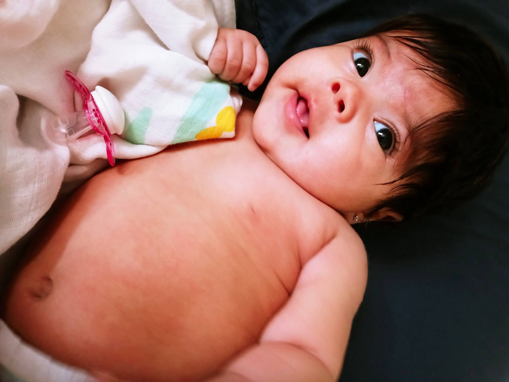 Emma is registered to the contest to win money with this photo: abdomen, baby, cheek, chest, eyelash, facial_expression, finger, flash_photography, gesture, happy, hat, iris, lip, mouth, muscle, nose, person, skin, stomach, sun_hat