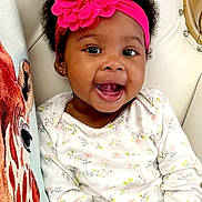 Zuri is registered to the contest to win money with this photo: accessories, adult, baby, babylaughing, bride, face, female, happy, head, headband, jewelry, laughing, necklace, person, photography, portrait, smile, wedding, woman
