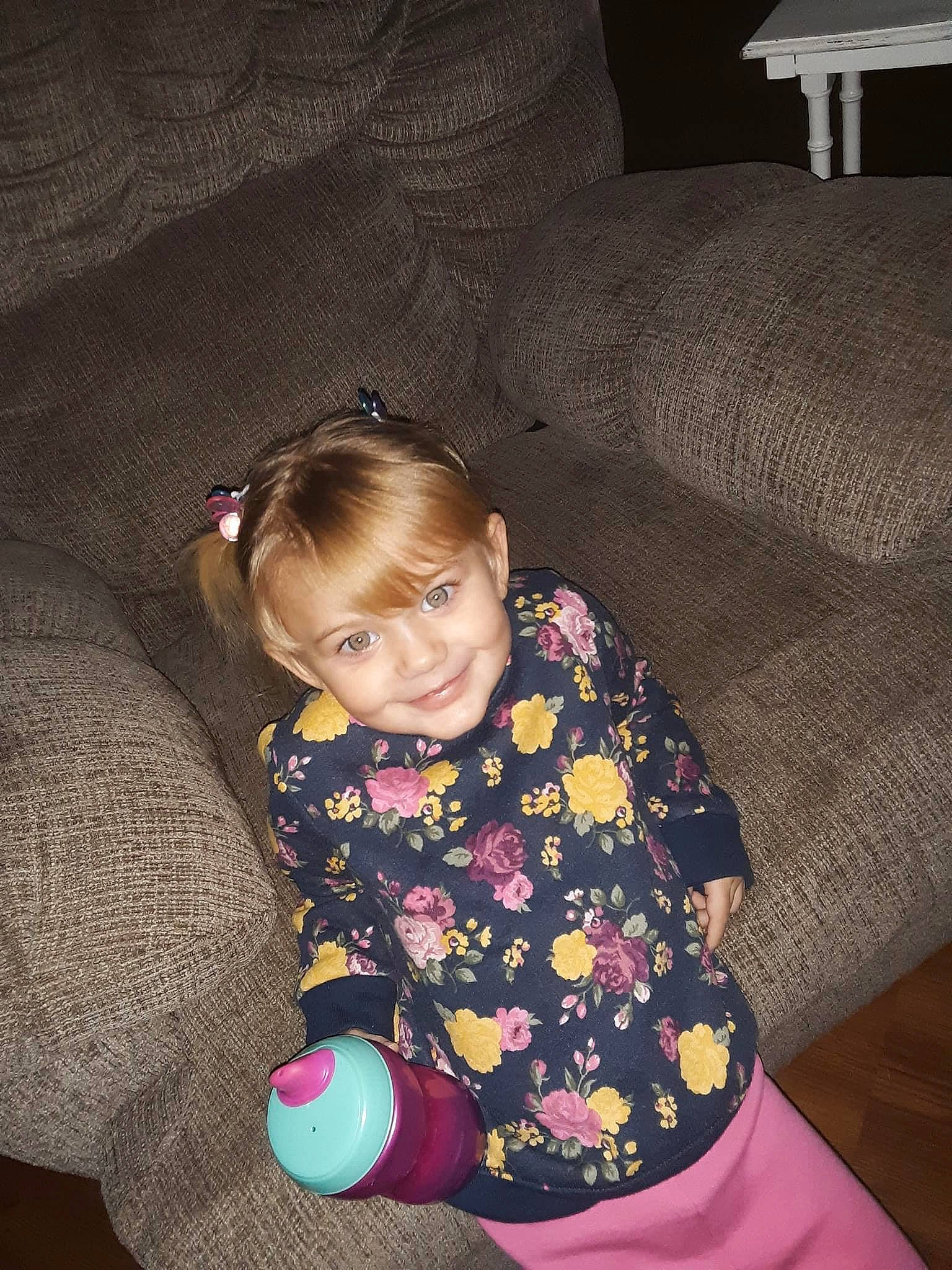 Paezlie is registered to the contest to win money with this photo: baby_toddler_clothing, cheek, comfort, couch, eye, face, flash_photography, floor, flooring, fun, hairstyle, happy, head, iris, joy, mammal, person, purple, skin, sleeve