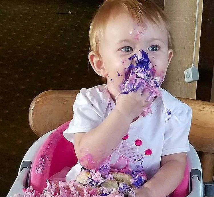 Paezlie is registered to the contest to win money with this photo: baby, baby_playing_with_food, baby_toddler_clothing, biting, cheek, child, eye, finger, happy, iris, lip, mouth, nose, person, pink, play, sitting, skin, sleeve, sweetness