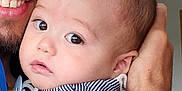 Eliote participe au concours pour gagner de l'argent avec cette photo : baby, child, person, face, adult, holding, striped_clothing, closeup, portrait, hand, cute, eyes, skin, head, expression, indoor, human, love, affection, gentle