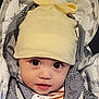 Eliote a rejoint le concours — aidez-le/la à gagner de superbes lots ! baby, child, hat, yellow_hat, striped_jacket, blanket, star_pattern, pacifier, big_eyes, cute, infant, clothing, face, portrait, baby_accessory, indoors, closeup, young_child, adorable, warm_clothing