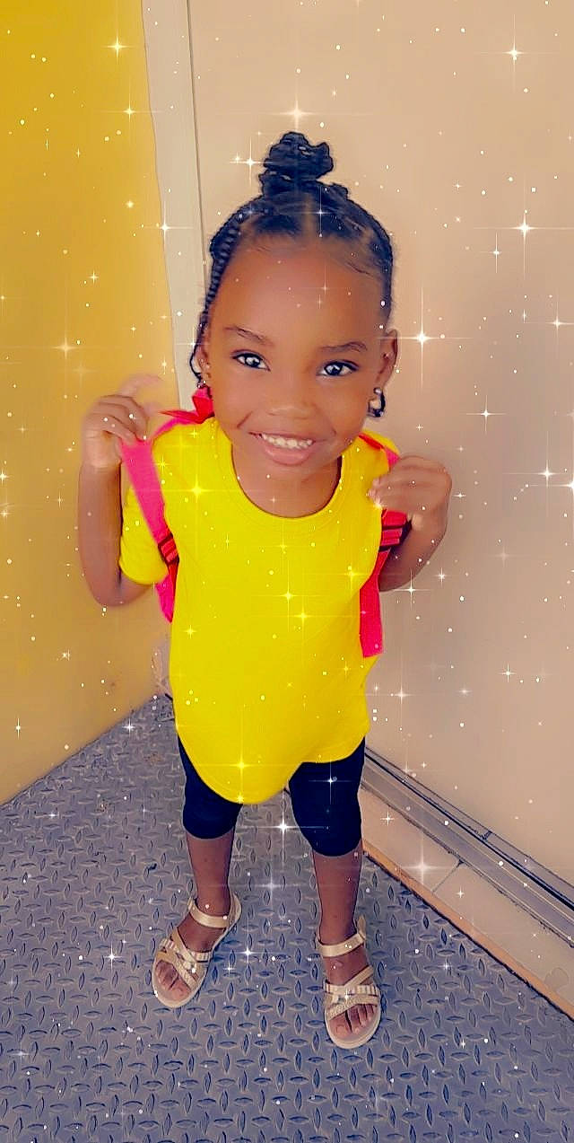 Withney a rejoint le concours — aidez-le/la à gagner de superbes lots ! black_hair, child, doll, fashion_design, finger, fun, hairstyle, happy, joint, joy, leisure, person, pink, sandal, skin, sleeve, smile, standing, thigh, toddler