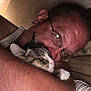 adult, affection, animal, bed, cat, close_up, comfort, cuddle, facial_expression, feline, glasses, hug, human, indoor, man, pet, relaxation, skin, tabby_cat, whiskers