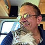 Baby joined the competition — help win amazing prizes! casual_clothing, cat, closeup, companionship, domestic_animal, facial_hair, fluffy_cat, furniture, glasses, holding, home, human, indoor, man, pet, portrait, relaxed, short_hair, smile, window
