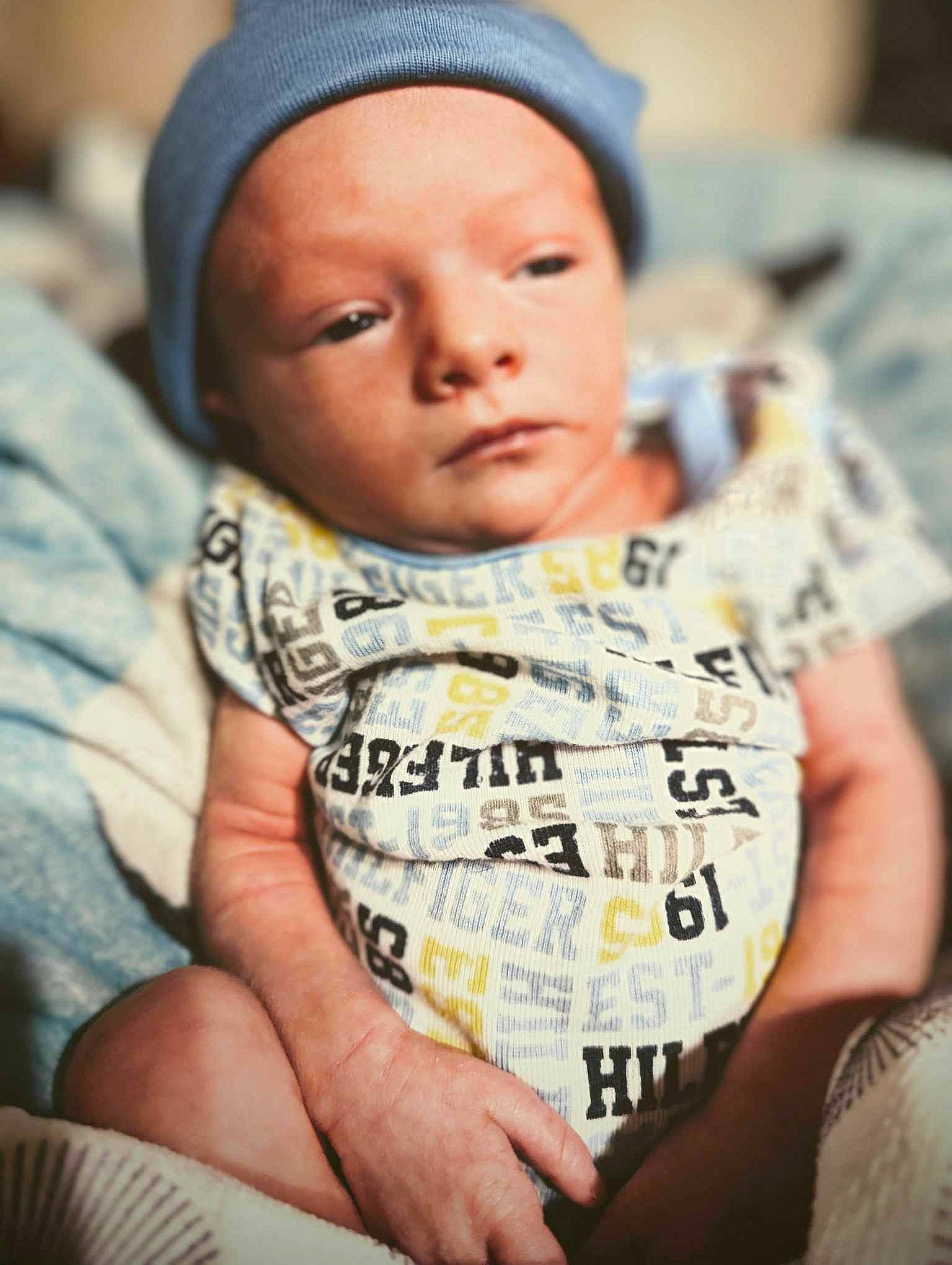 Cygnus is registered to the contest to win money with this photo: baby, baby_toddler_clothing, beanie, beauty, cap, cheek, child, comfort, face, forehead, happy, headwear, linens, lip, nose, person, portrait_photography, sitting, skin, sleeve