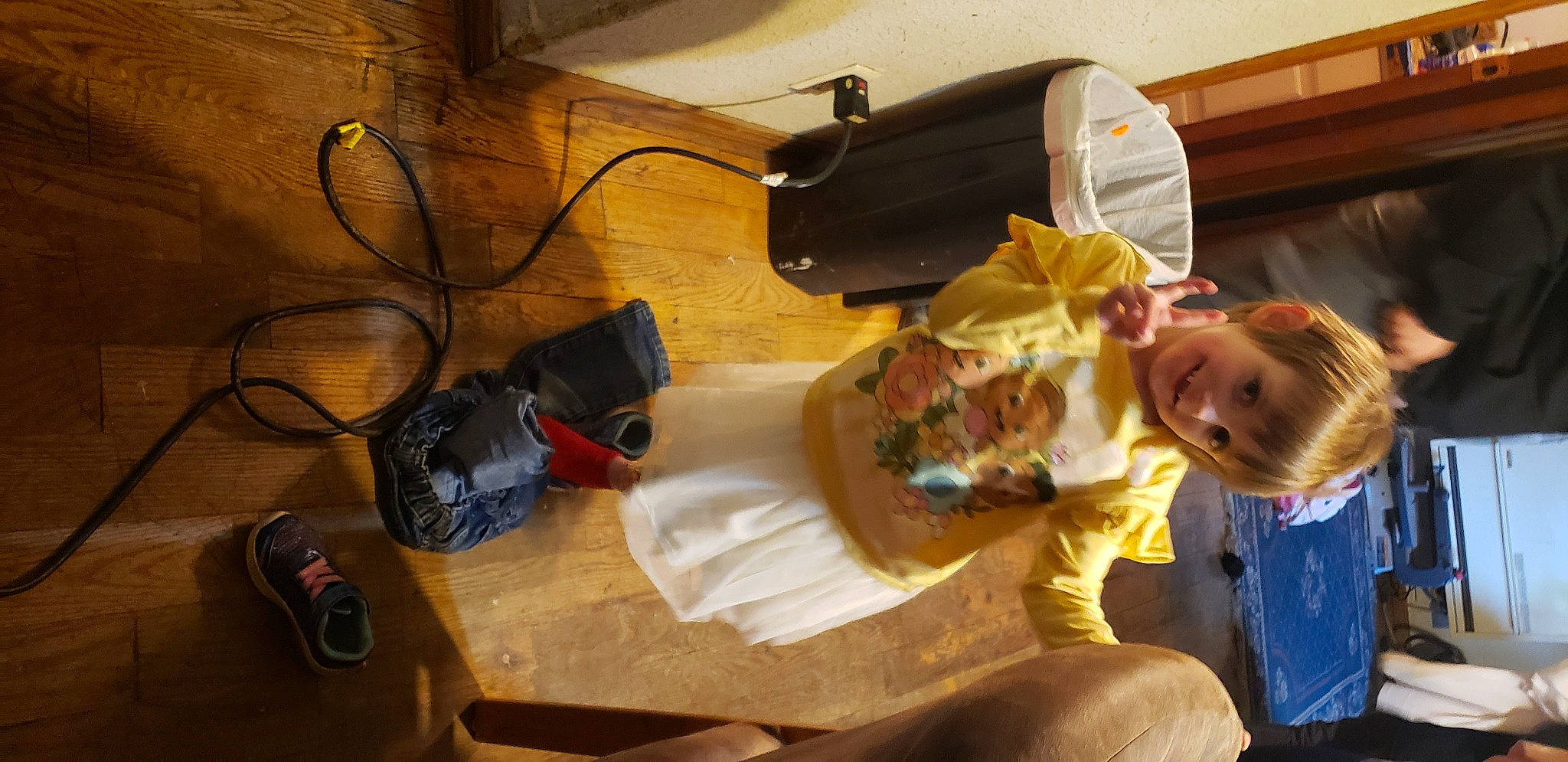 Hailee is registered to the contest to win money with this photo: audio_equipment, baby, bag, cable, child, electrical_wiring, eyewear, fun, gadget, joy, luggage_and_bags, person, personal_protective_equipment, room, sitting, smile, table, toddler, toy, wire