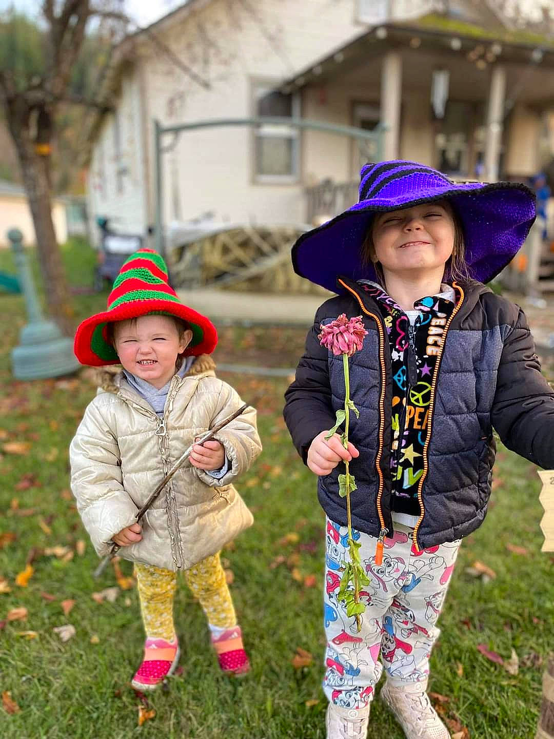 Amelia is registered to the contest to win money with this photo: clothing, community, fun, grass, green, happy, hat, headwear, jacket, joy, leaf, leisure, outerwear, people_in_nature, person, plant, public_space, purple, recreation, smile