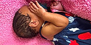 Daja joined the competition — help win amazing prizes! baby, infant, newborn, child, pink_blanket, soft_texture, hand, arm, ear, hair, sleeping, clothing, stars, navy_blue, red, white, cute, resting, cozy, portrait