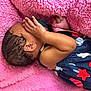 baby, infant, newborn, child, pink_blanket, soft_texture, hand, arm, ear, hair, sleeping, clothing, stars, navy_blue, red, white, cute, resting, cozy, portrait
