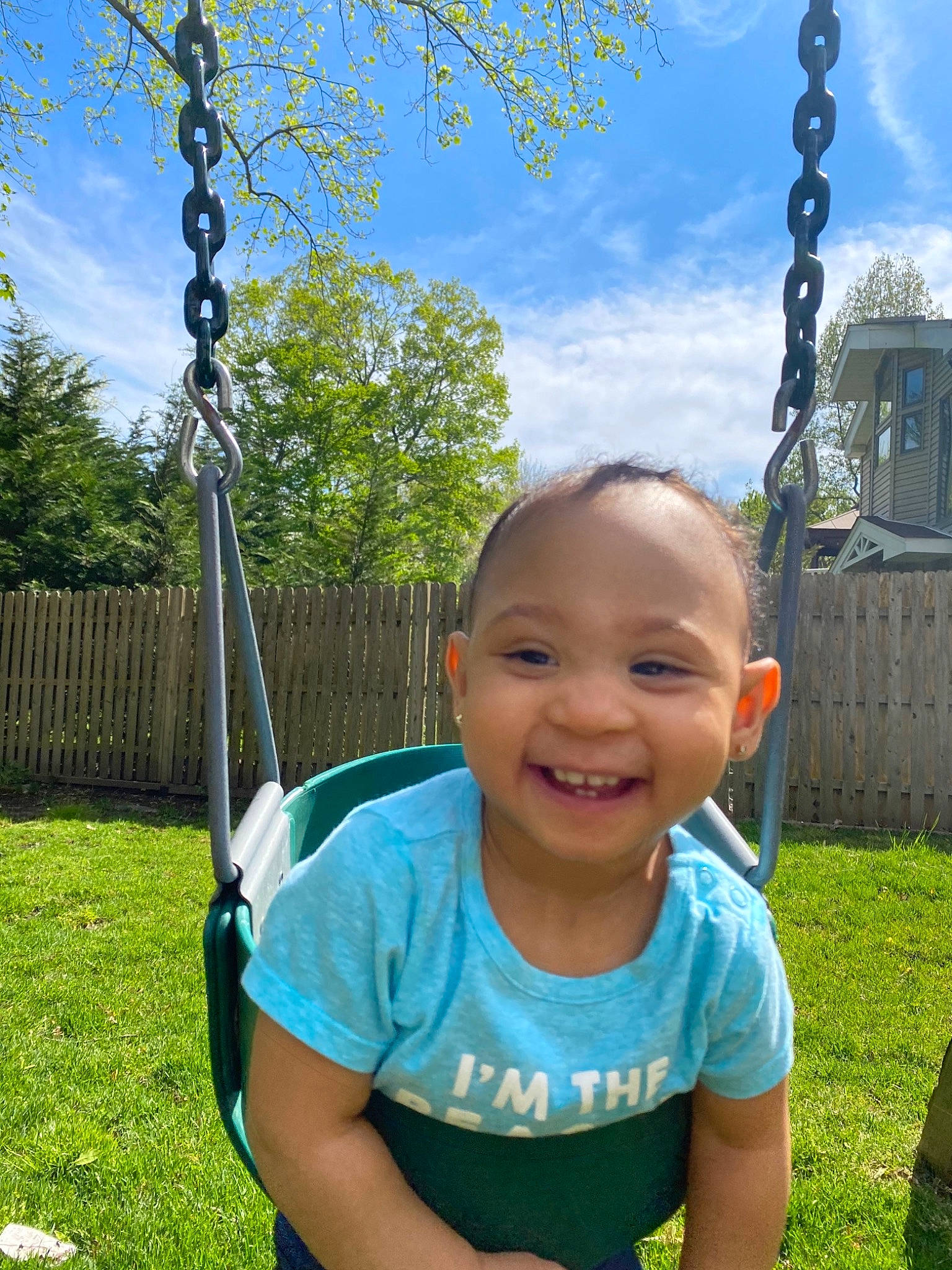Amiya is registered to the contest to win money with this photo: baby_toddler_clothing, cloud, cool, eye, fun, grass, hairstyle, happy, joy, leaf, leisure, mammal, nature, people_in_nature, person, plant, sky, smile, swing, toddler