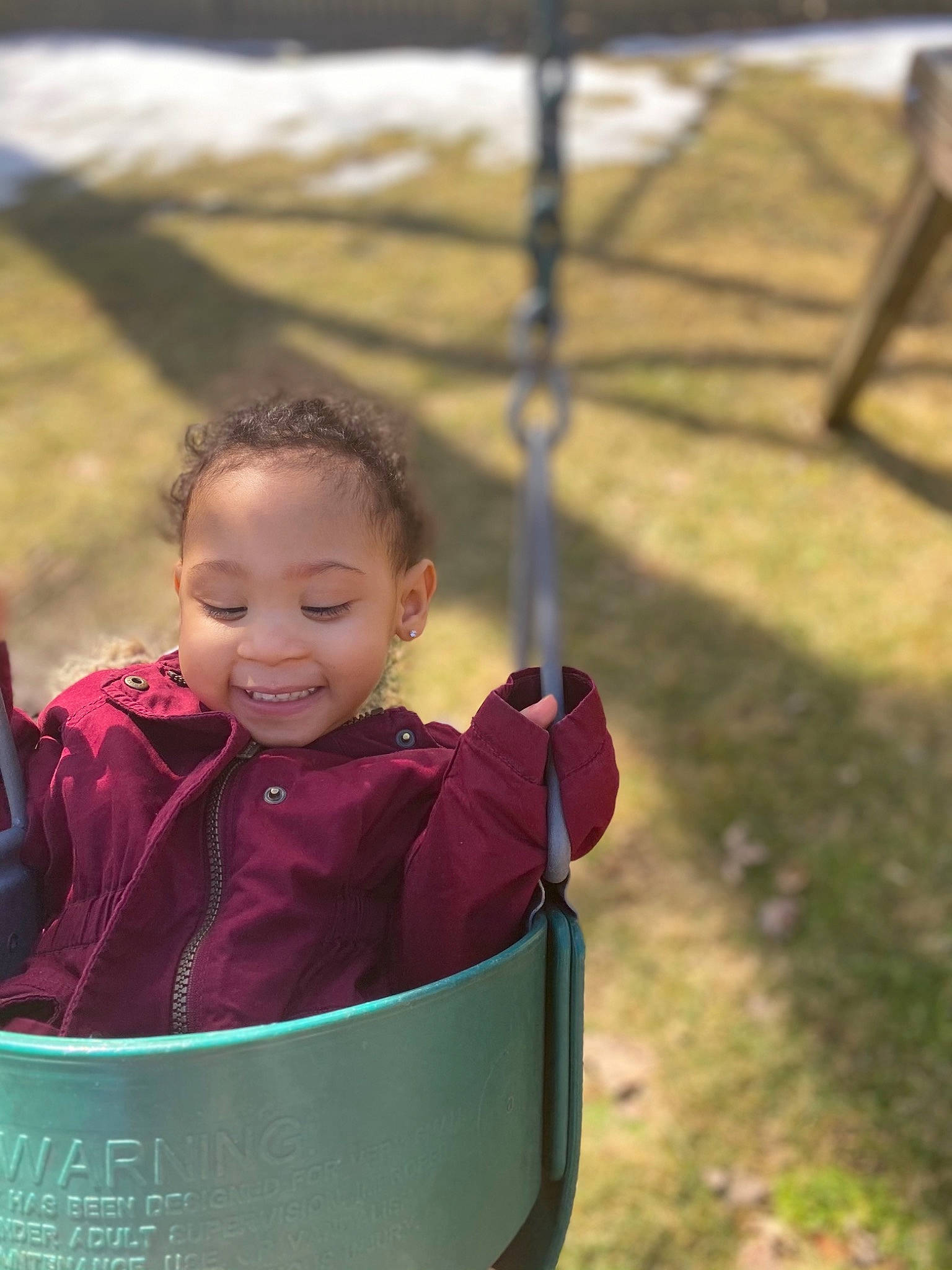 Amiya joined the competition — help win amazing prizes! child, fun, grass, happy, jacket, joy, laugh, leisure, magenta, outdoor_play_equipment, people_in_nature, person, plant, play, playground, recreation, sitting, skin, smile, toddler