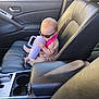 Zena Kay Balch is registered to the contest to win money with this photo: baby, child, sunglasses, car_interior, car_seat, leather_seat, sippy_cup, drinking, cute, infant, seat_belt, window, door, center_console, car, passenger_seat, fashion, accessory, sunlight, casual