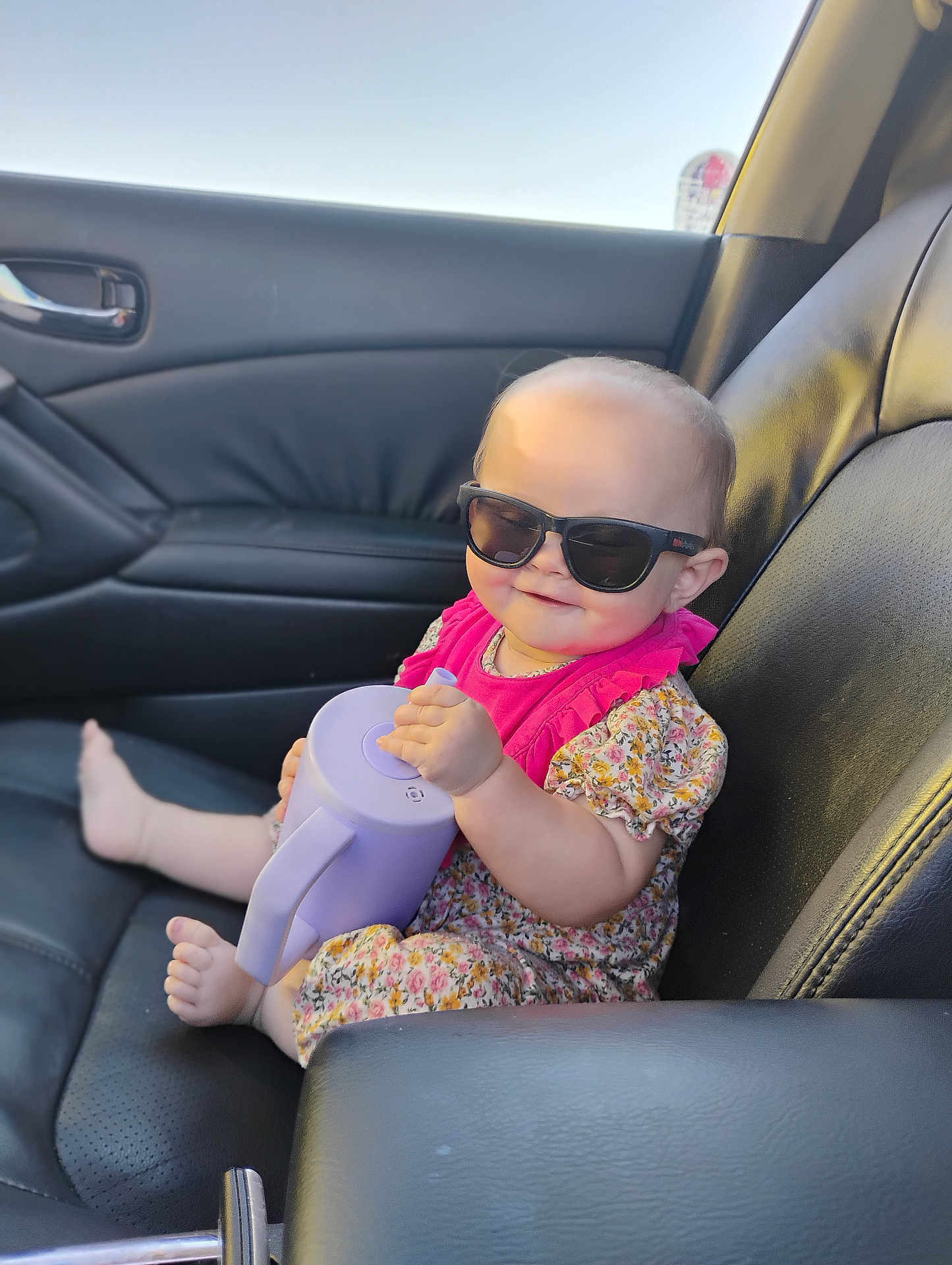 Zena Kay Balch joined the competition — help win amazing prizes! baby, sunglasses, car_seat, leather, watering_can, floral_dress, pink, child, smile, cute, summer, sunlight, portrait, indoors, seat, foot, hand, toy, cool, happy