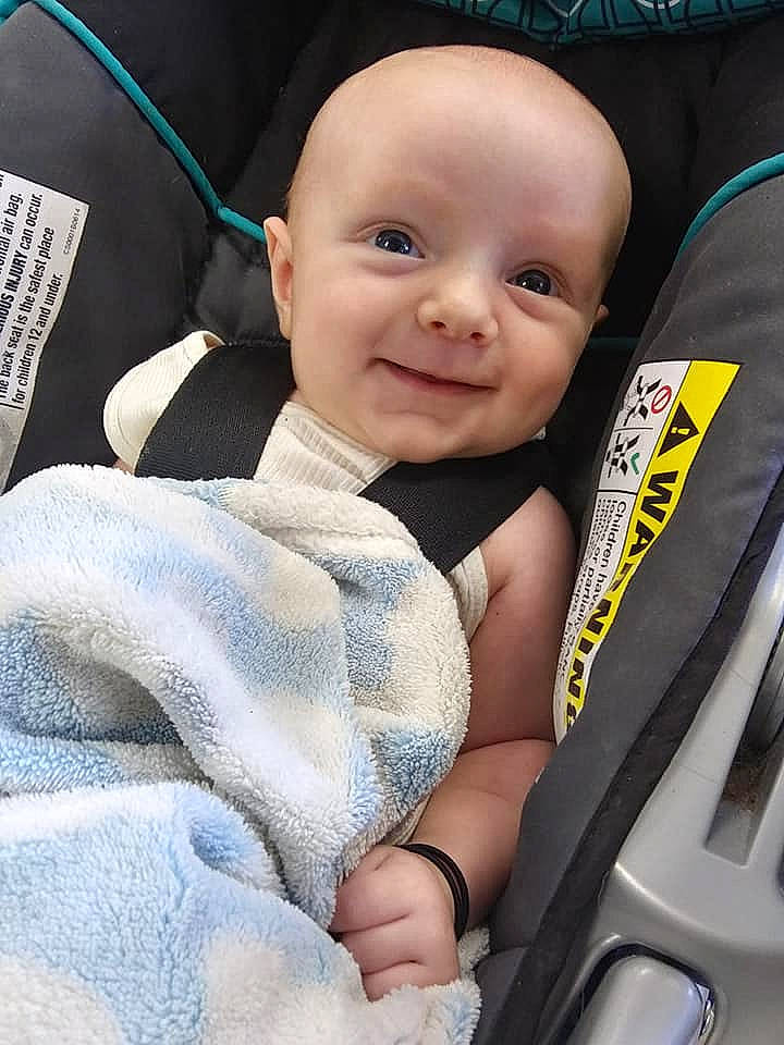 Braydon is registered to the contest to win money with this photo: auto_part, baby, baby_carriage, baby_in_car_seat, baby_products, car_seat, cheek, child, joy, person, product, seat_belt, skin, toddler