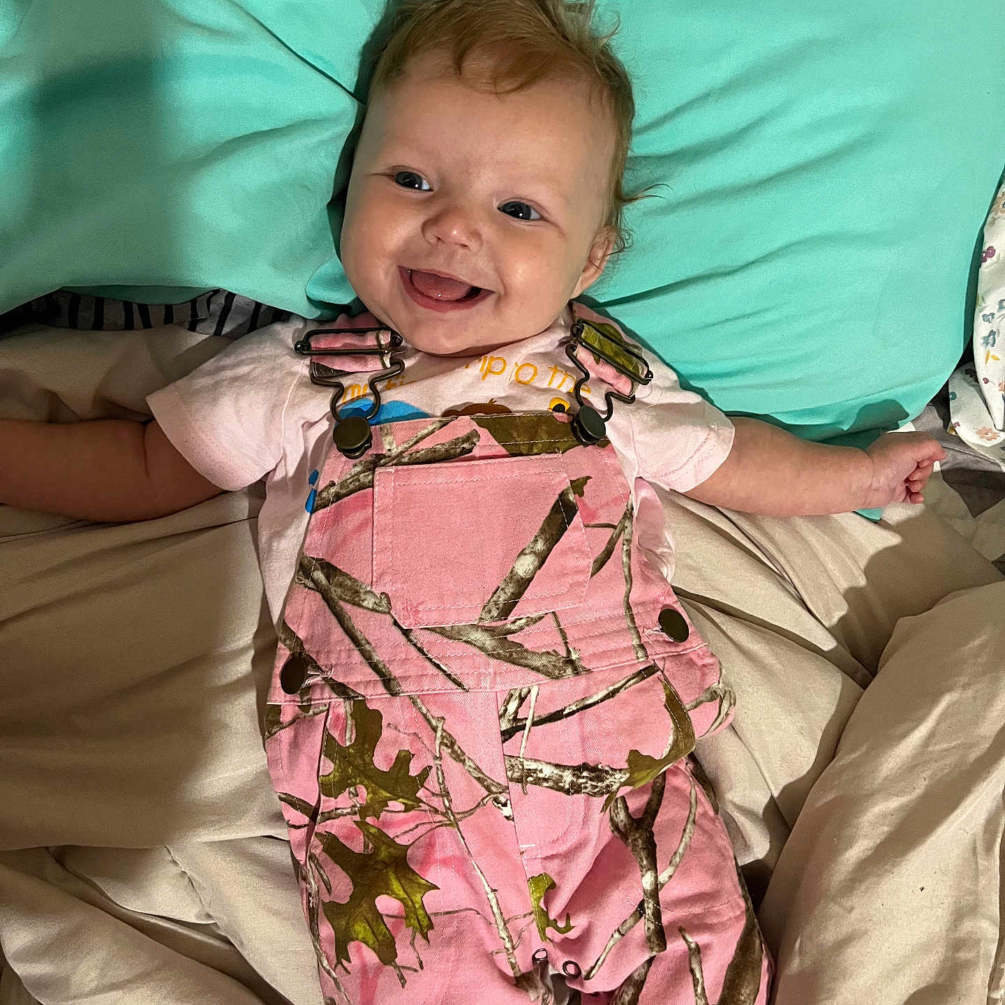 Airelyn is registered to the contest to win money with this photo: baby, babylaughing, blanket, bodypart, clothing, couch, cushion, dress, face, finger, formalwear, furniture, hand, happy, head, homedecor, person, photography, portrait, smile