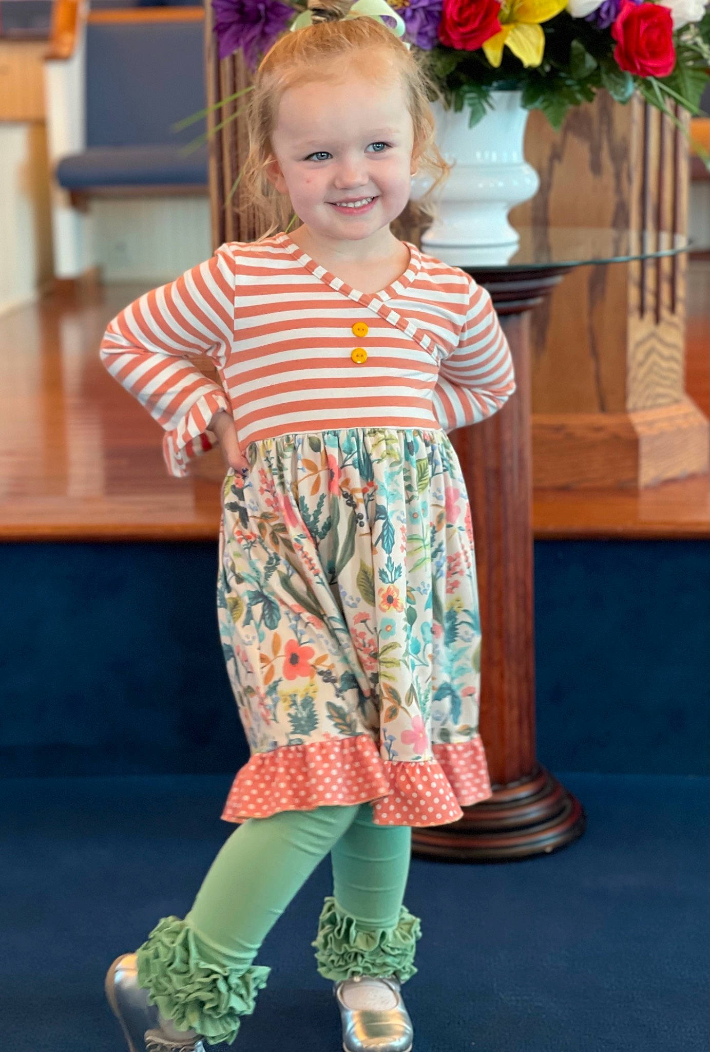 Ava is registered to the contest to win money with this photo: baby_toddler_clothing, blue, child, dress, fashion_design, flower, fun, green, happy, head, joy, magenta, pattern, person, pink, plant, skin, sleeve, smile, toddler