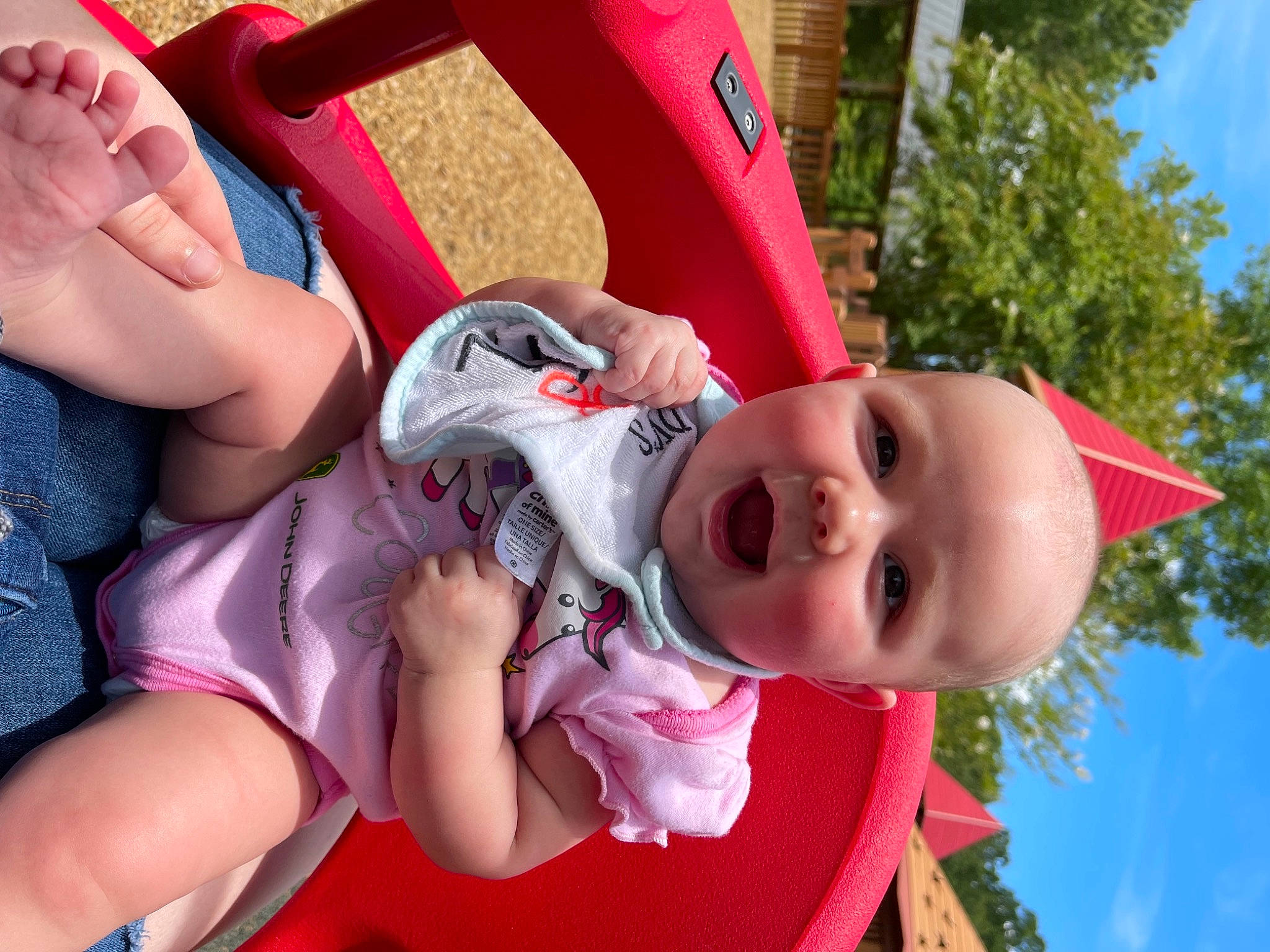 Meredith joined the competition — help win amazing prizes! baby_toddler_clothing, comfort, facial_expression, fun, grass, hand, happy, house, human_body, leisure, mouth, person, pink, plant, recreation, skin, sky, thigh, toddler, tree